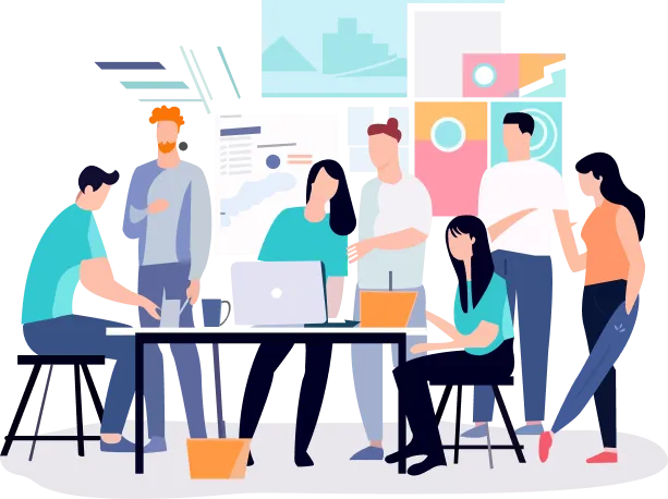 a group of people, some standing and some sitting, gathered around a table with laptops and other electronic devices